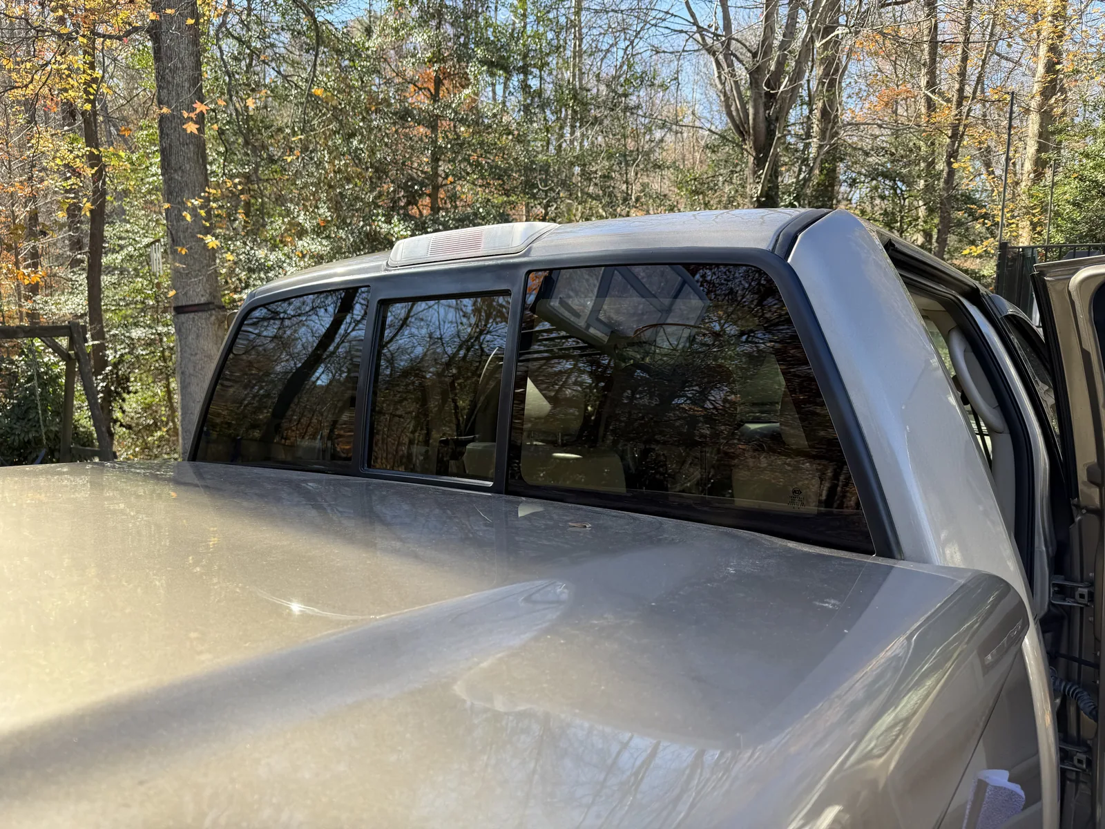 Rear slider window on a silver pickup truck