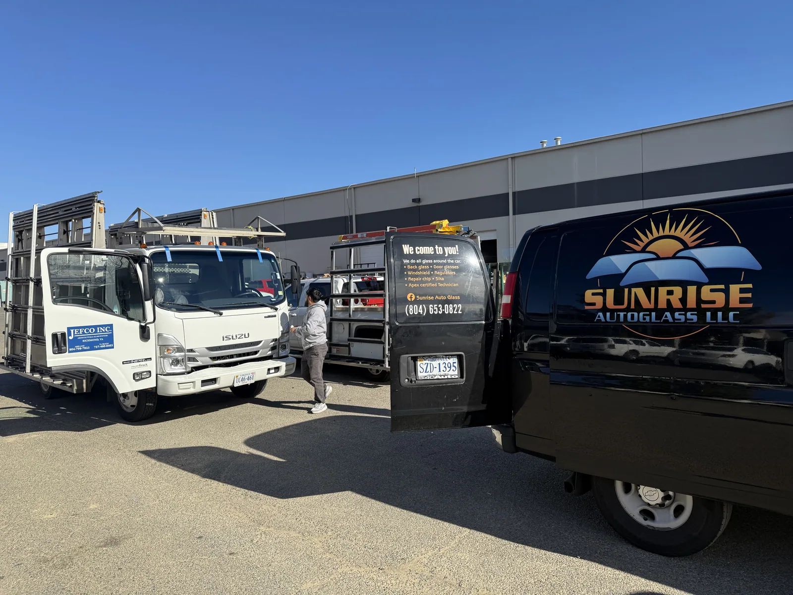 Sunrise AutoGlass van and supplier trucks at the glass warehouse