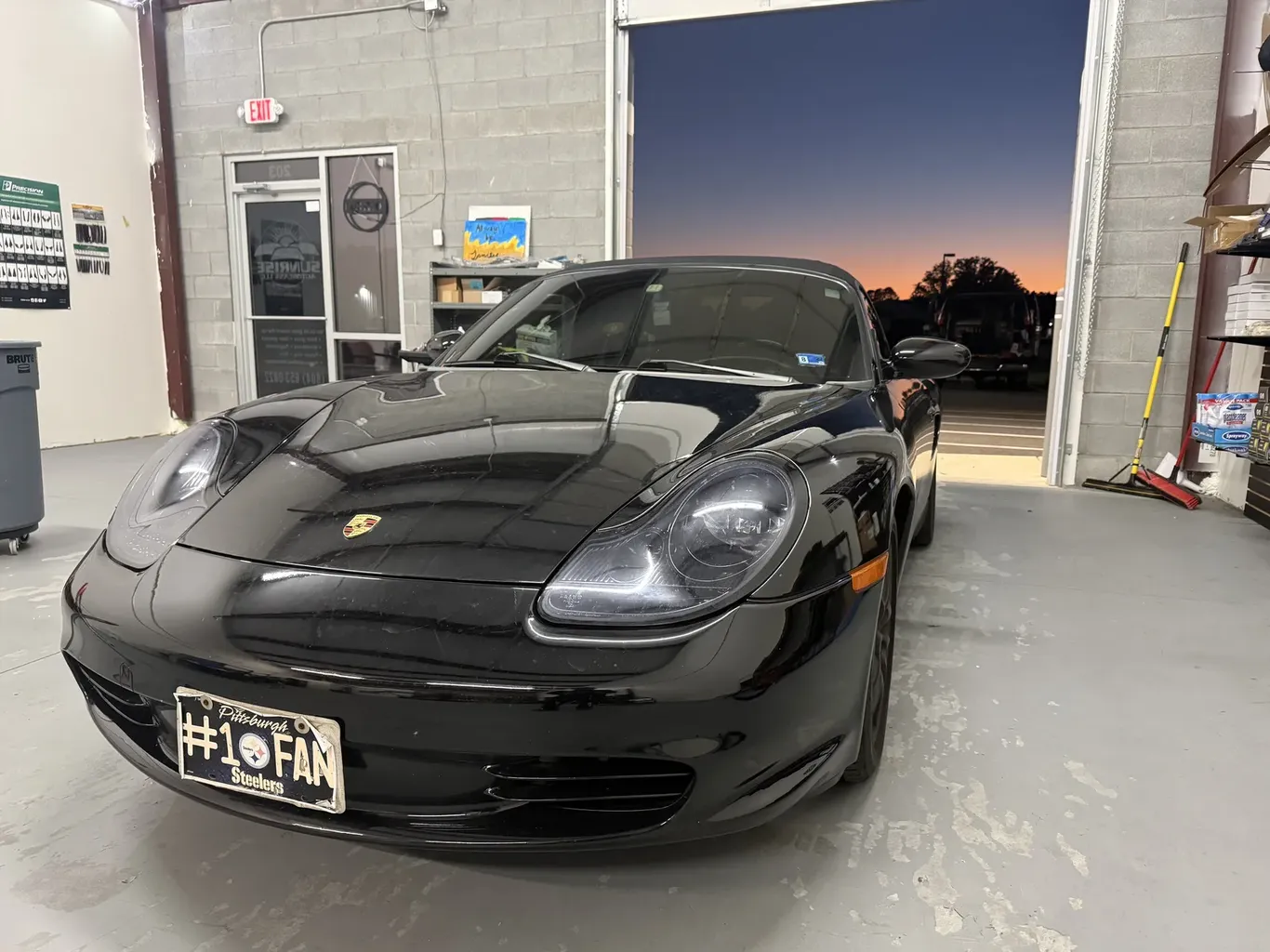 Porsche in the Sunrise AutoGlass bay at sunset